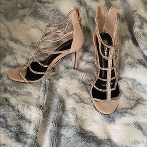 Bedazzled nude heels.